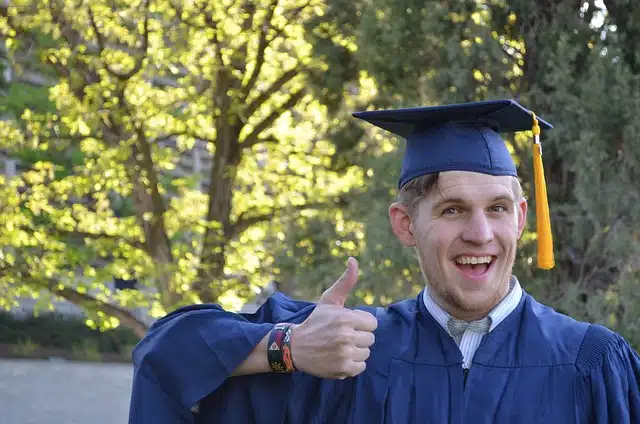 a graduate making a thumbs up sign