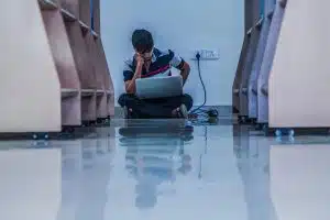 student studying in the library hallway - featured image