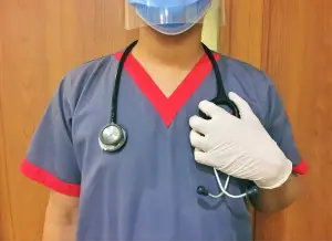 male nurse in full gear - featured image