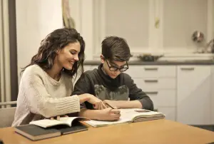 Mother helping her son with homework - featured image