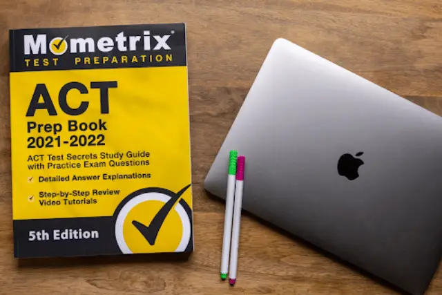 ACT prep book and laptop - featured image