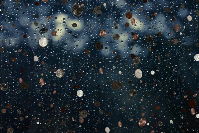 why did lencho say the raindrops were like new coins