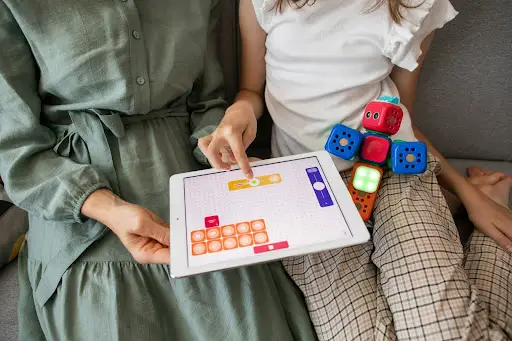 mother teaching math to daughter