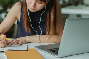 young lady taking notes - featured image